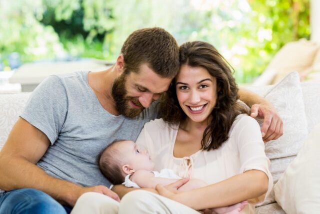 parents holding child