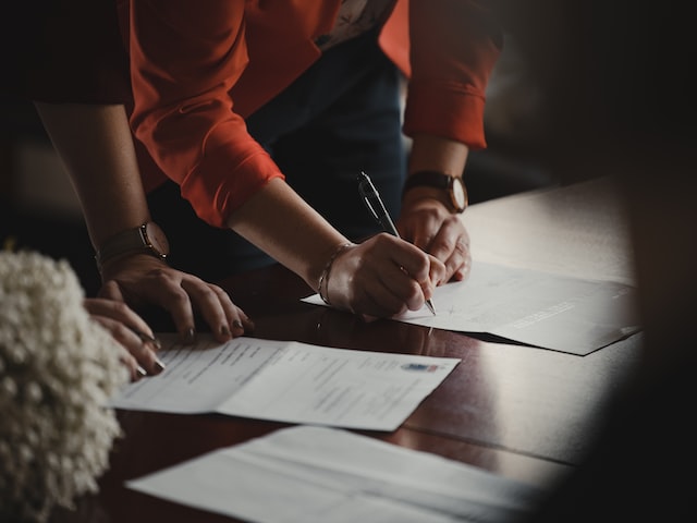 couple singing documents